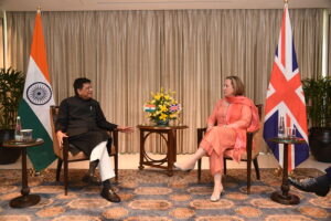 UK trade minister and Indian trade minister sit together during India-UK trade negotiations in India 2022