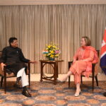UK trade minister and Indian trade minister sit together during India-UK trade negotiations in India 2022