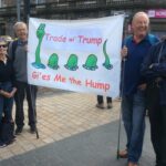 Paul Robison holding Nessie banner with 'Trade wi Trump gies me the hump' wording